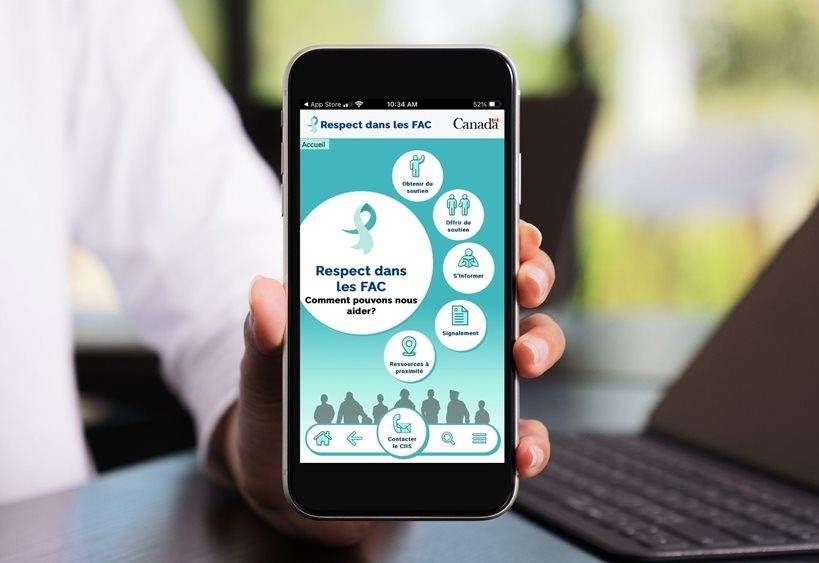 Person's hand holding mobile device with the RitCAF mobile App homepage