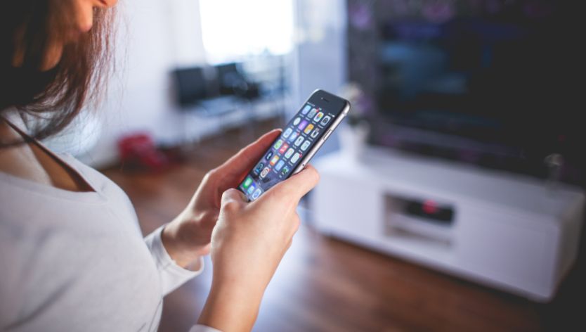 woman looking at phone