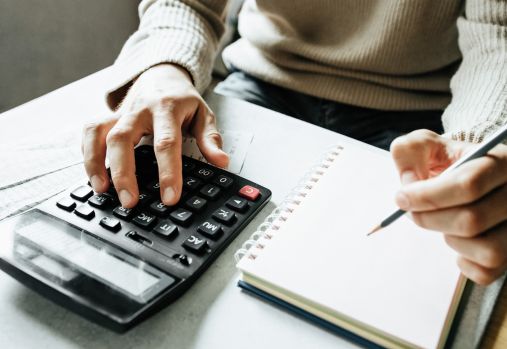 Man using a calculator