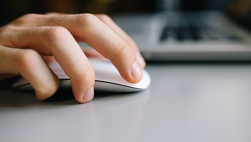 hand on computer mouse