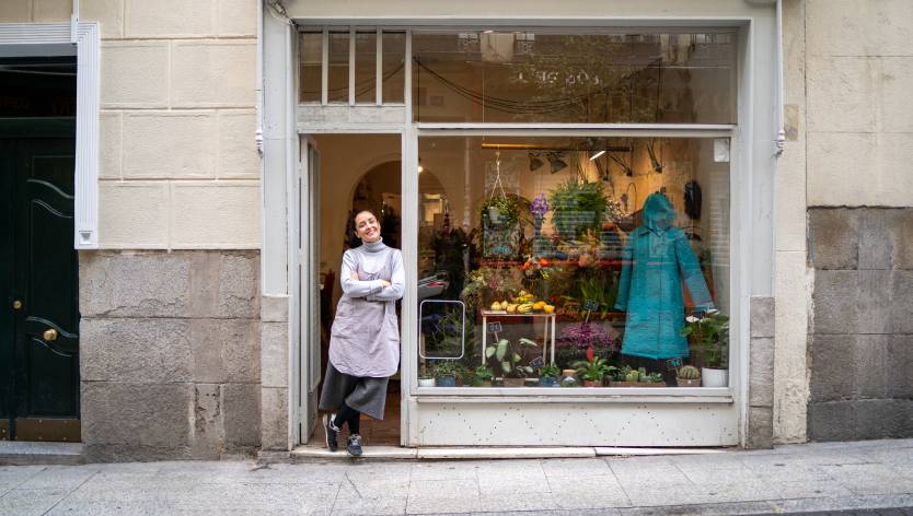 Woman standing in front of store