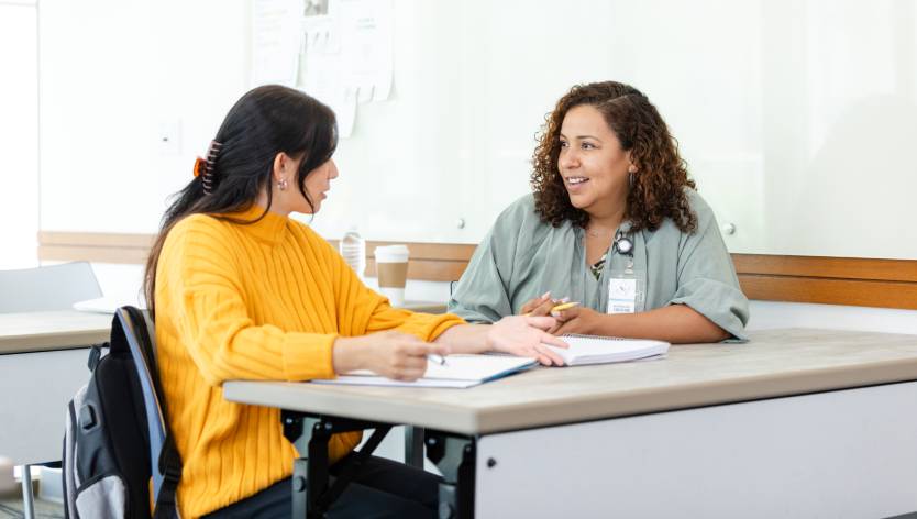 tutor helping a high school student