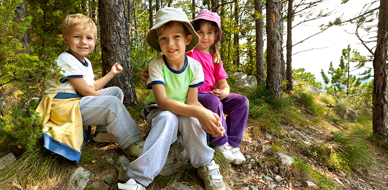 kids sitting in woods