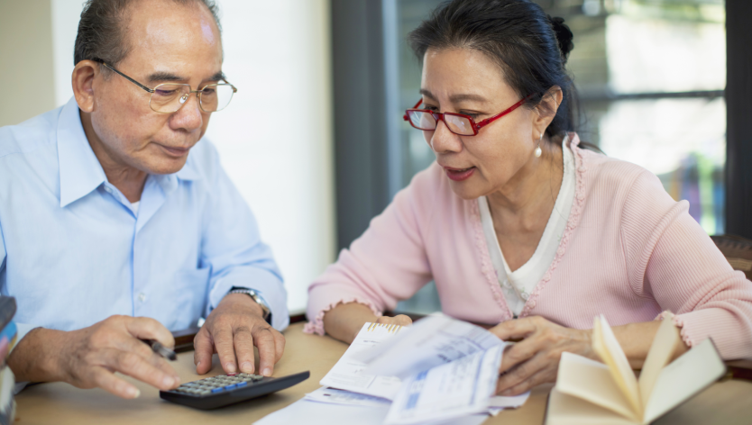 couple in front of calcualtor