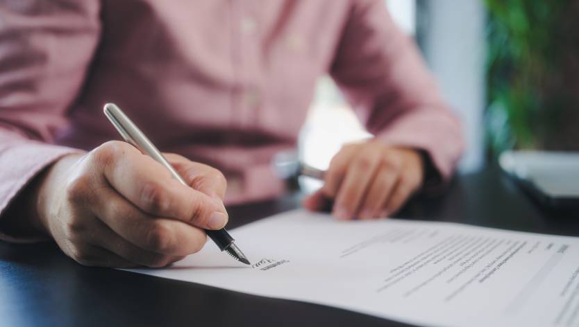Man signing a contract