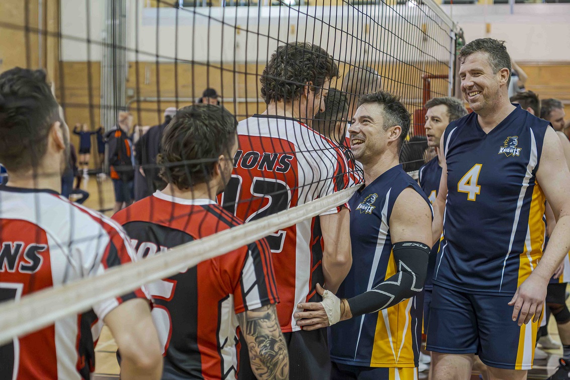 man holding volleyball